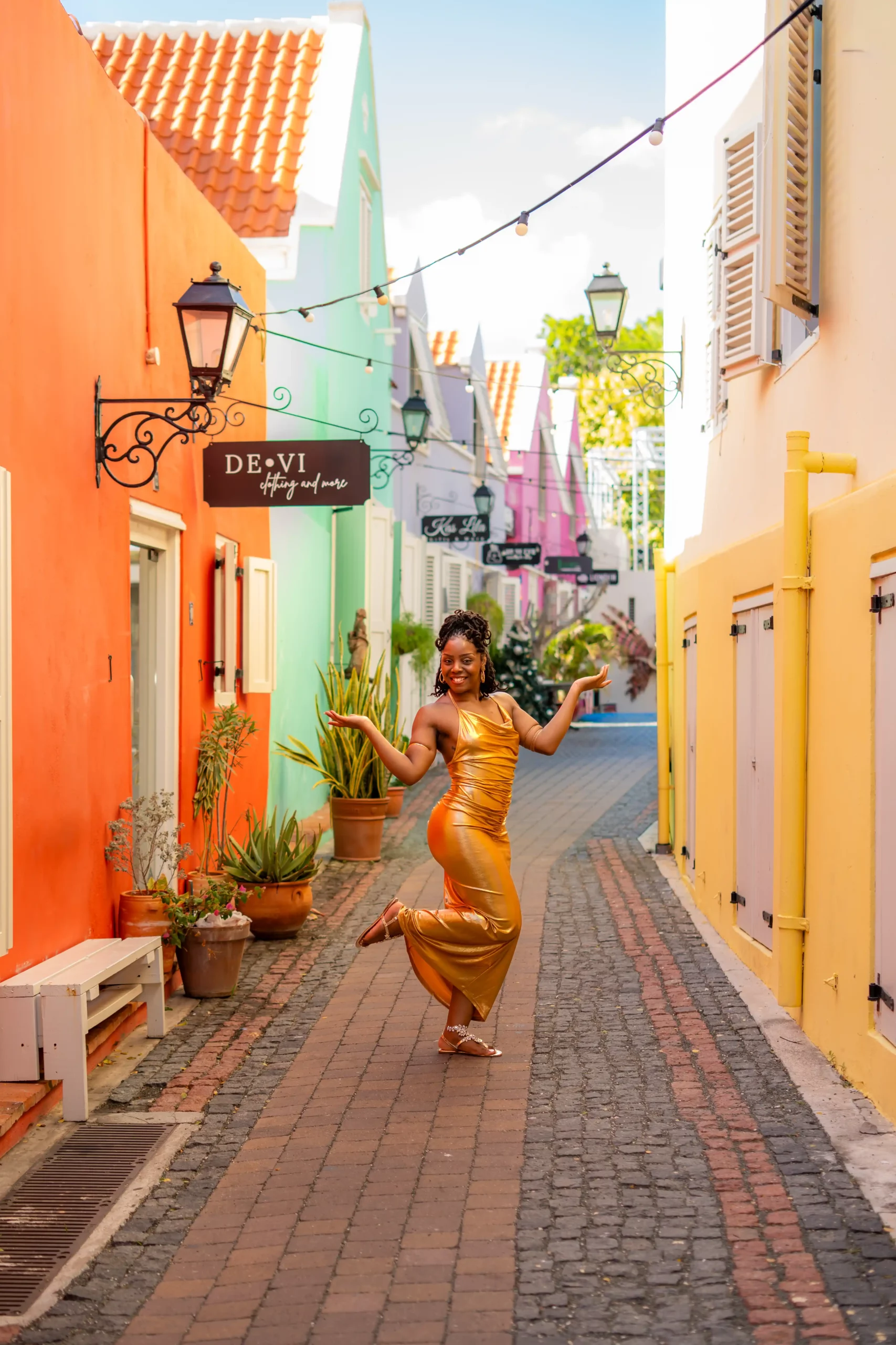 portfolio gold dress woman tropical city photoshoot